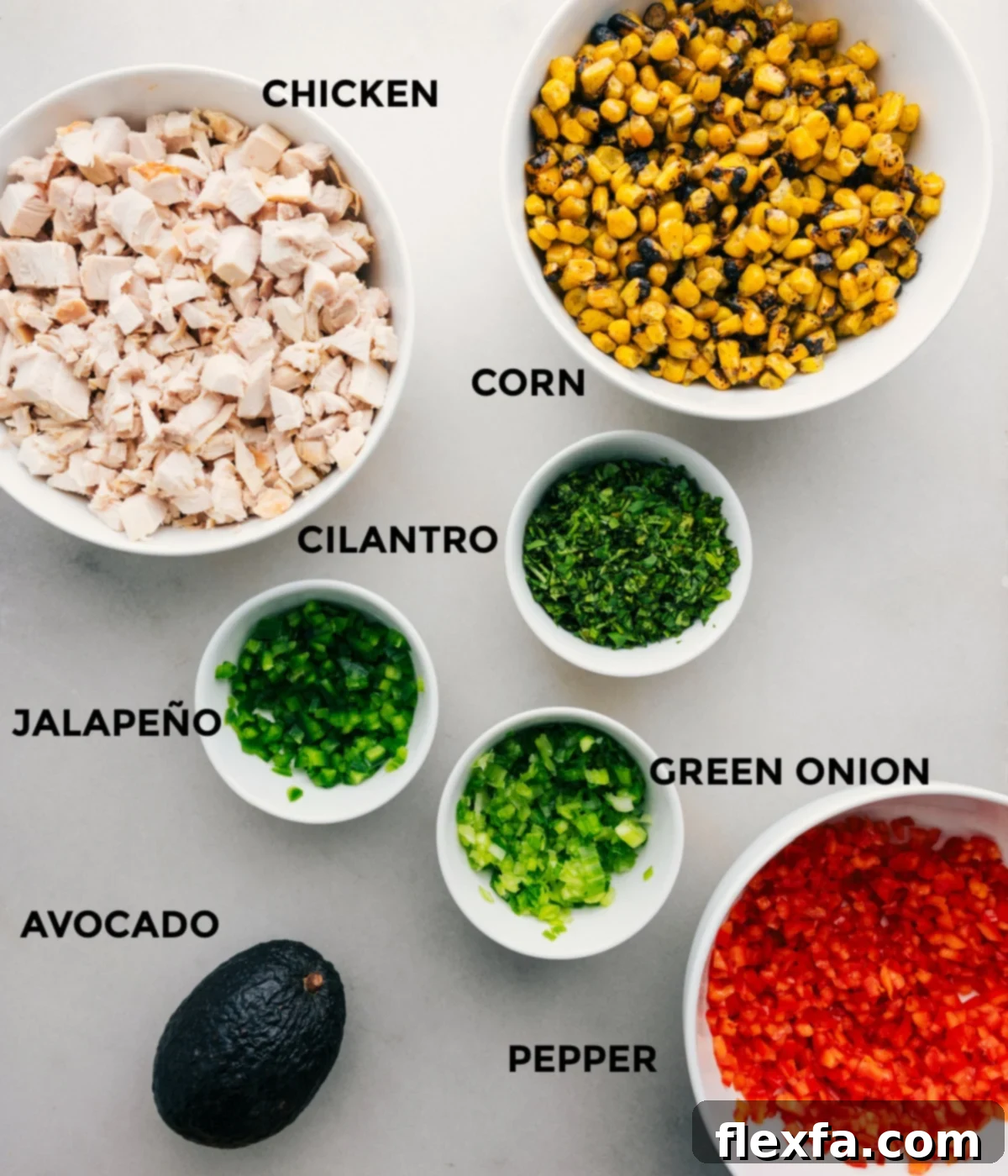 The ingredients for Mexican street corn chicken salad prepped out for easy assembly.