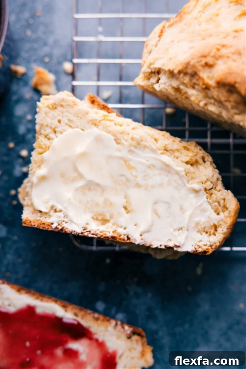 Overhead image of a beautifully baked, golden-brown No-Yeast Bread loaf, ready for slicing.