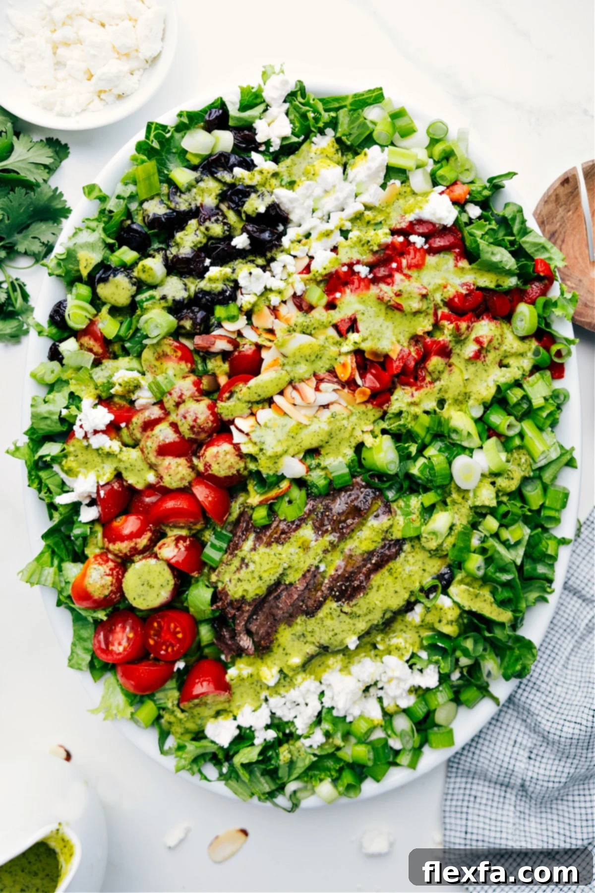 Preparing to Toss: Freshly Dressed Steak Salad with Vibrant Vegetables Freshly Dressed Steak Salad with Vibrant Vegetables, ready to be tossed and served