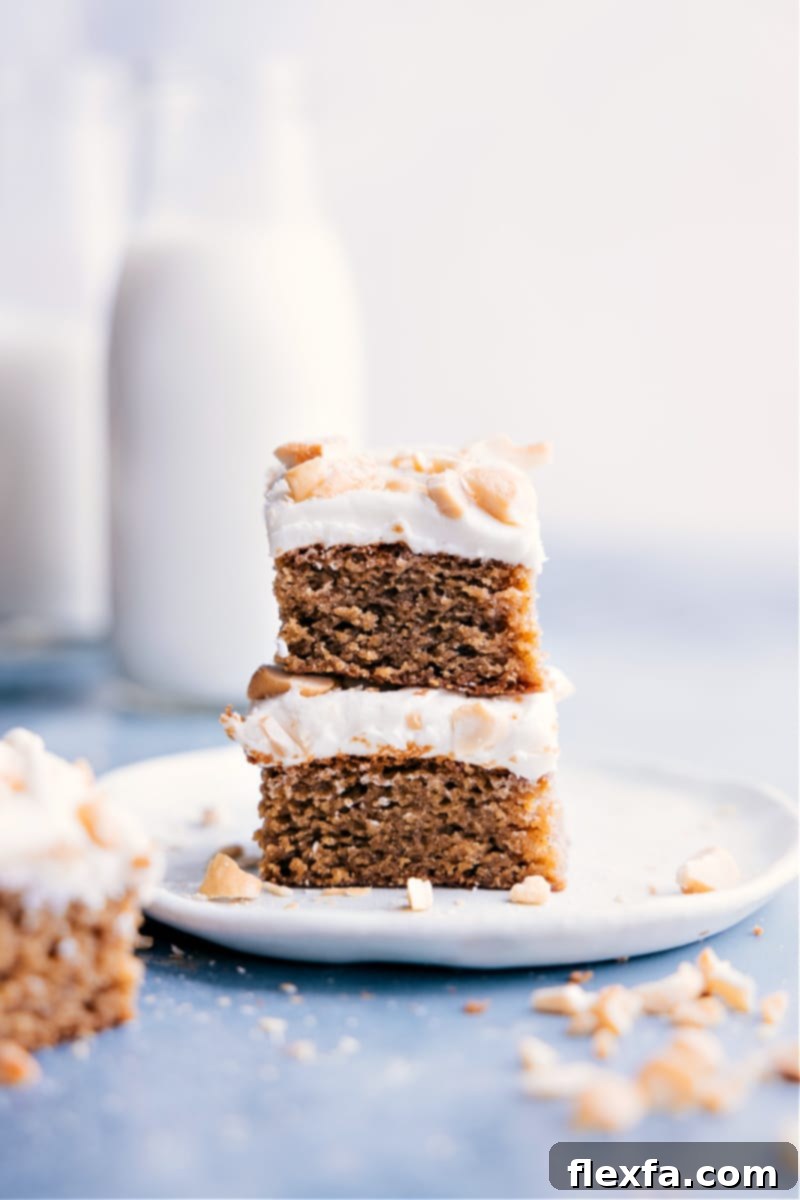Image of Cashew Cake slices stacked on top of each other, beautifully frosted and ready to be enjoyed