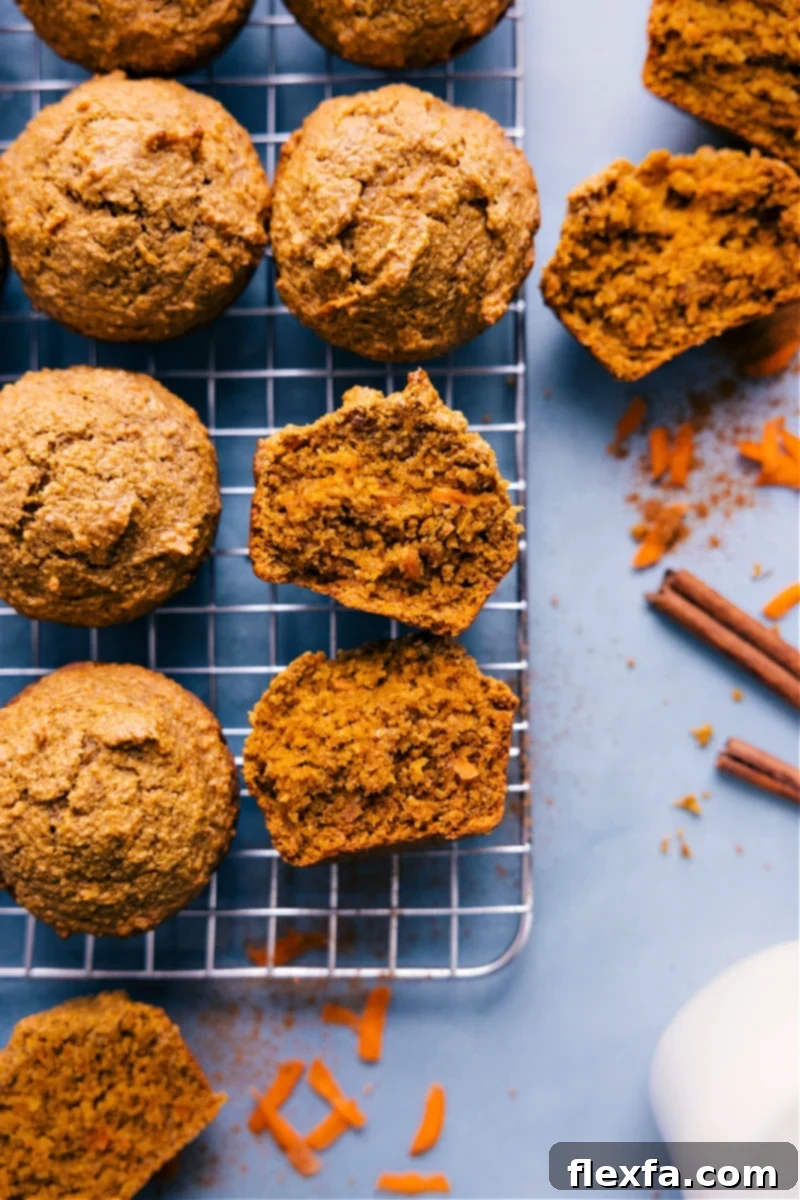 A beautifully composed shot of freshly baked Healthy Carrot Muffins, golden and inviting, with a focus on their textured tops and healthy appeal.