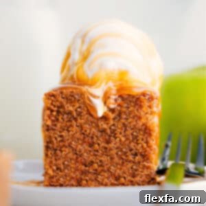 A beautifully sliced Healthy Apple Cake, showcasing its moist, dense texture and warm spices, ready to be enjoyed.