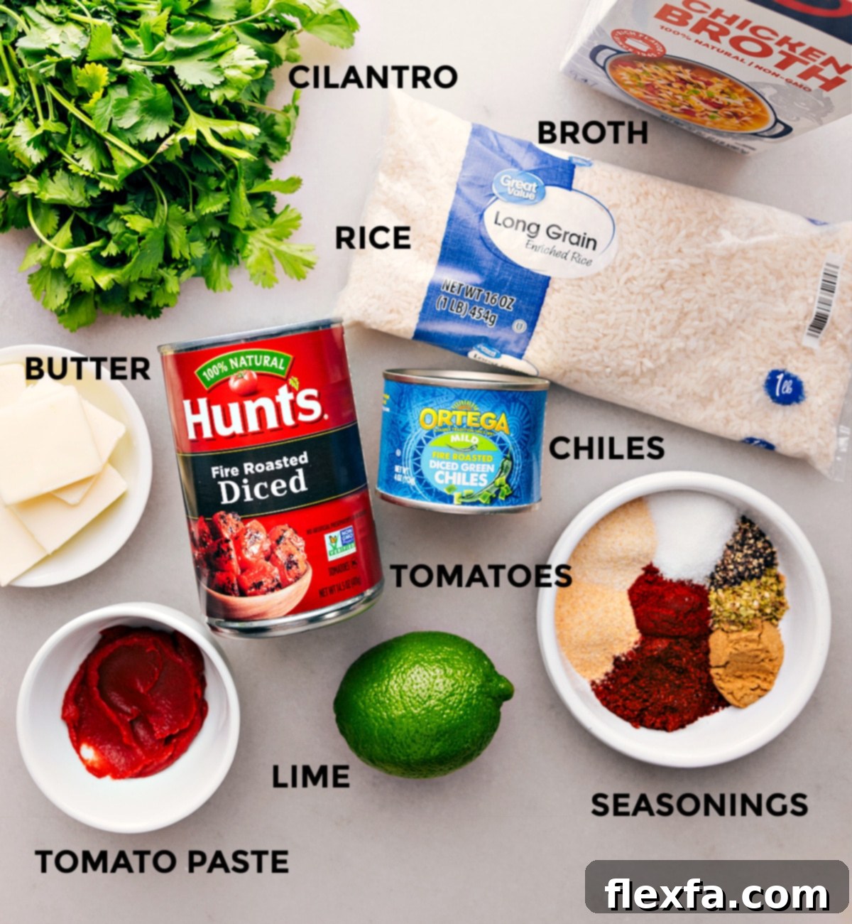 Quick And Easy Baked Mexican Rice Recipe Ingredients Carefully prepped ingredients for the Mexican Rice recipe laid out on a clean surface, including rinsed long-grain rice, a can of diced tomatoes, chicken stock, mild green chiles, and a selection of aromatic spices like chili powder and cumin, all meticulously arranged for easy assembly.