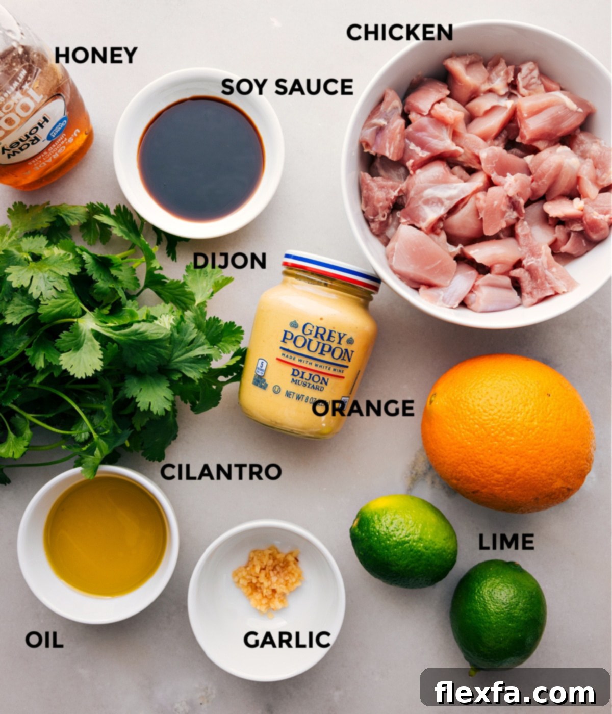 Ingredients In Citrus Chicken Marinade All the vibrant ingredients for the citrus chicken marinade laid out: chicken, soy sauce, honey, Dijon mustard, fresh oranges, cilantro, garlic, and limes.