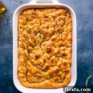 A square image of the finished Focaccia bread, golden and inviting.