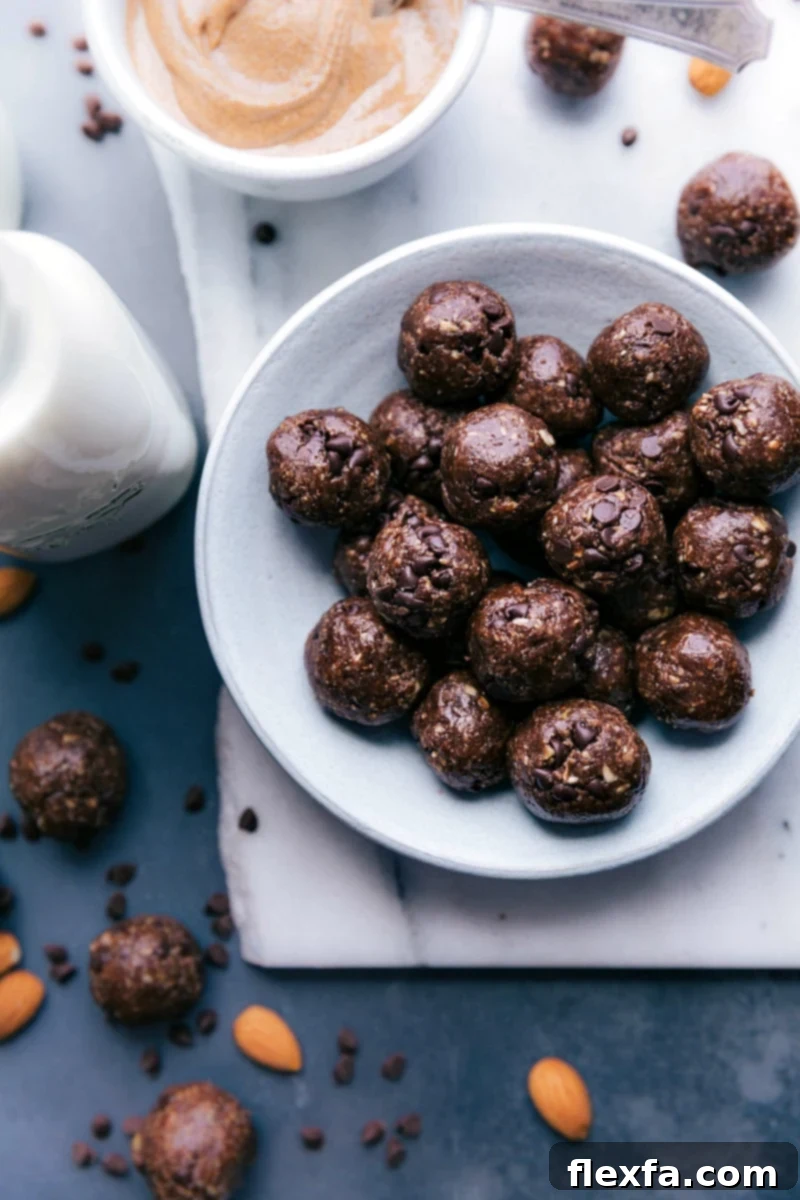 A close-up shot of several chocolate protein balls, showcasing their rich color and textured surface.