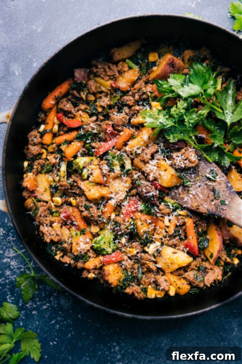 Overhead view of the completed Sausage and Veggie Skillet served in the pan, ready to be eaten.