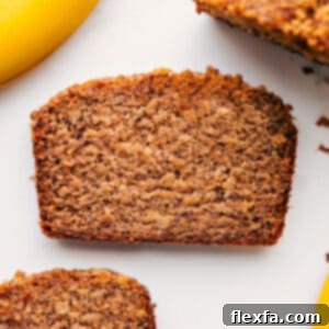 A perfectly baked loaf of Greek Yogurt Banana Bread, golden brown and inviting.