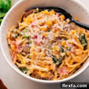 A close-up of the finished Corn and Sausage Pasta, showcasing its creamy texture and fresh ingredients.