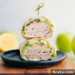 Healthy Turkey Wraps stacked on top of each other, ready to be enjoyed.