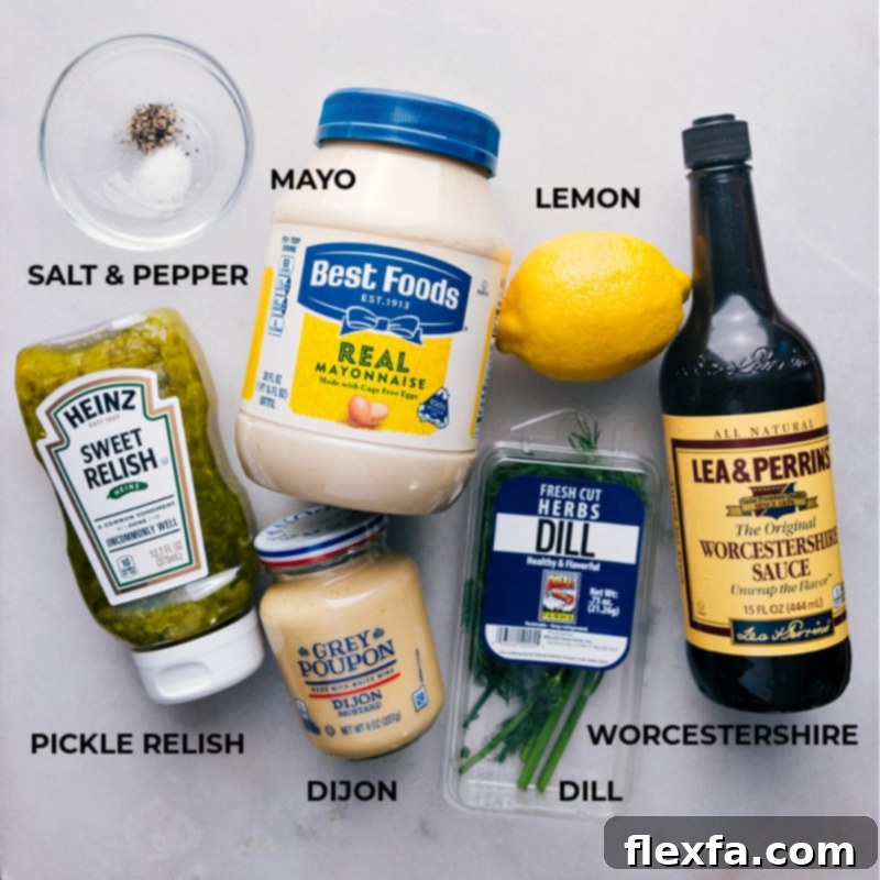 Discover the simple yet essential ingredients that make this tangy, zesty, and fresh Tartar Sauce recipe truly exceptional. Elevate your next seafood dish with just a few fresh items from your pantry. A vibrant flat lay image showcasing all the fresh ingredients for homemade Tartar Sauce: lemon, dill, mayo, relish, Worcestershire sauce, and Dijon mustard.
