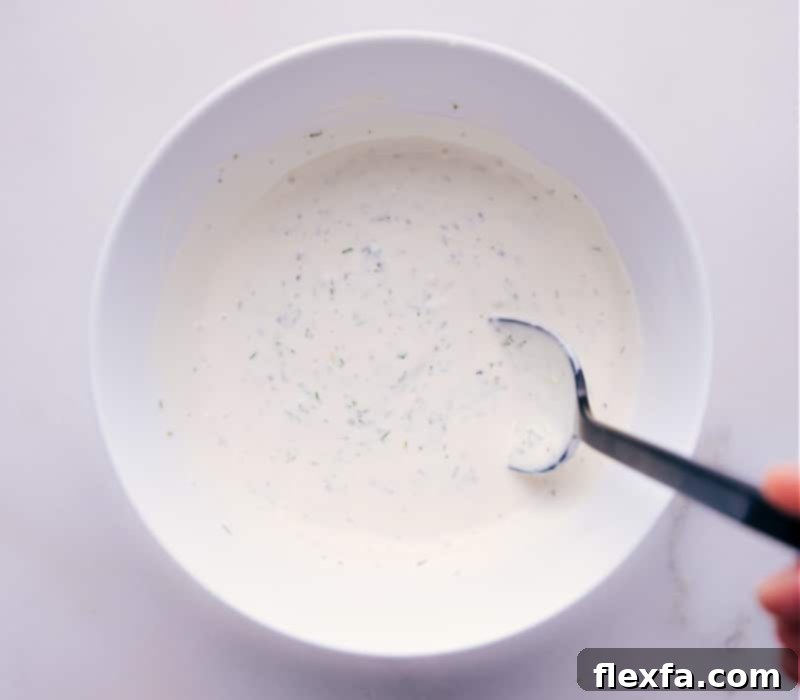 Your ultimate homemade Tartar Sauce, ready to elevate any meal. Tangy, zesty, and fresh – perfect for seafood lovers. A beautifully presented bowl of freshly made, creamy Tartar Sauce, garnished with fresh dill, ready to serve.