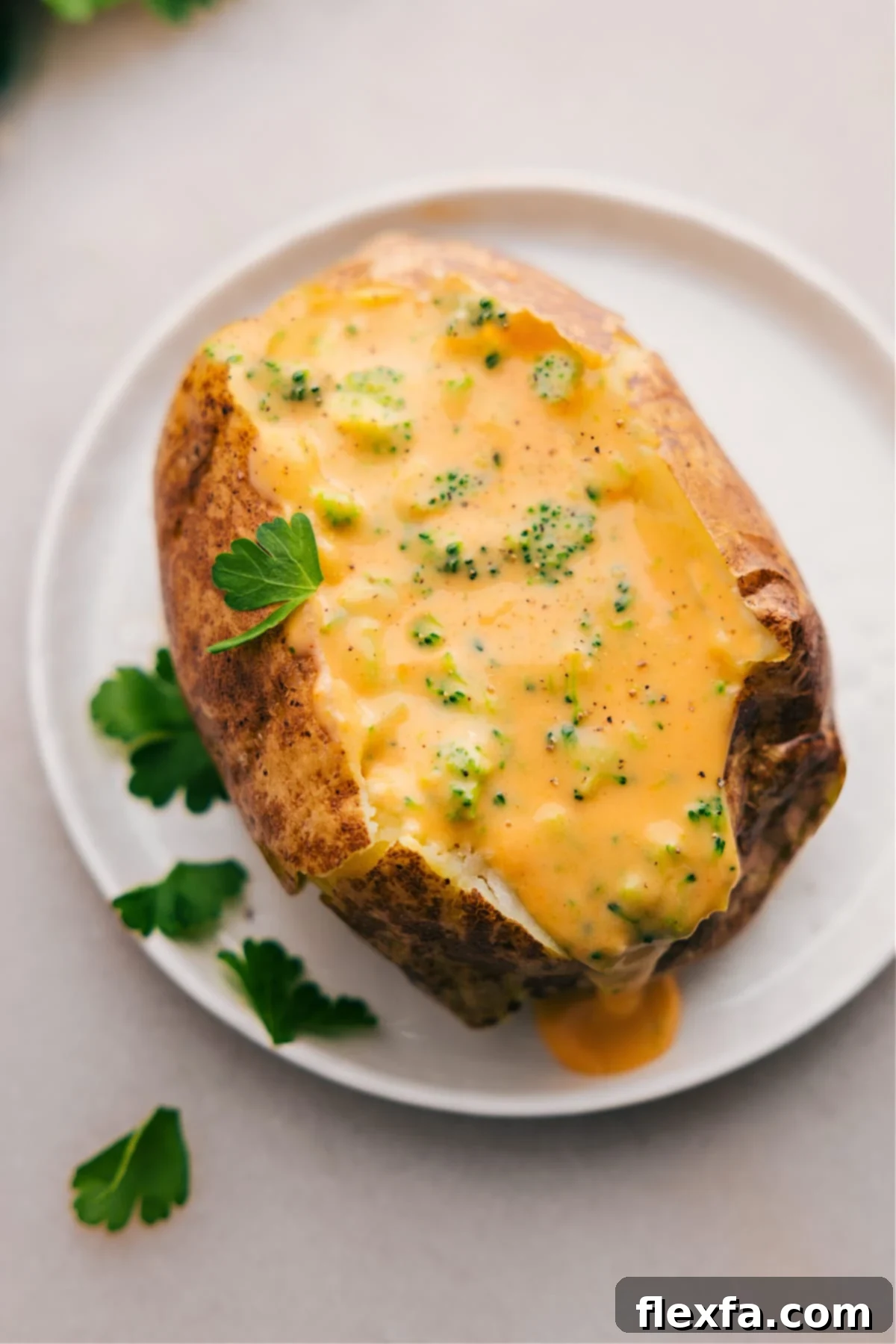 Serve Broccoli and Cheese Baked Potatoes on a plate, ready to enjoy.