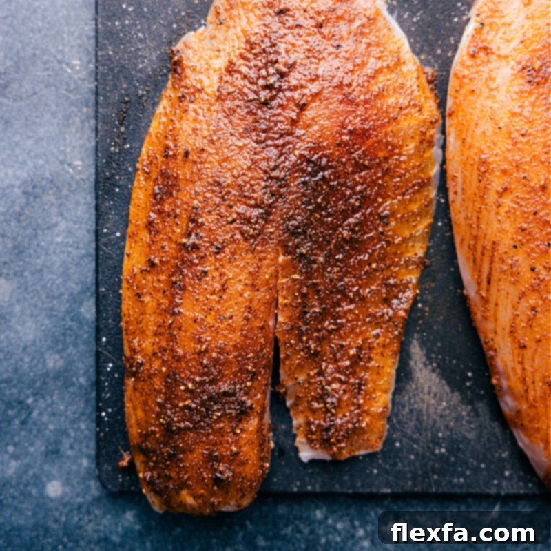 Seasoned tilapia fillets coated with a flavorful spice rub, ready for the air fryer.