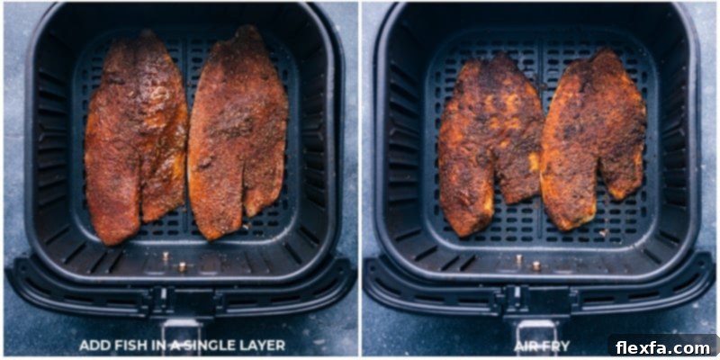 Tilapia fillets sizzling and turning golden brown inside an air fryer basket, mid-cooking process.