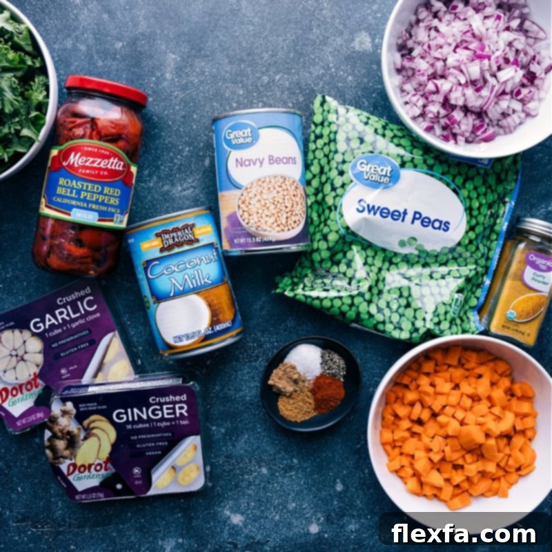 This Quick Vegan Curry is packed with good flavors and nutritious ingredients from the red pepper and coconut curry sauce to the plethora of veggies! Recipe via ChelseasMessyApron #dinner #easy #simple #best #fresh #cleaneating #vegetarian #familyfriendly #kidfriendly #quick #vegan #curry A flat lay image displaying all the fresh and jarred ingredients used to make the quick Vegan Curry.