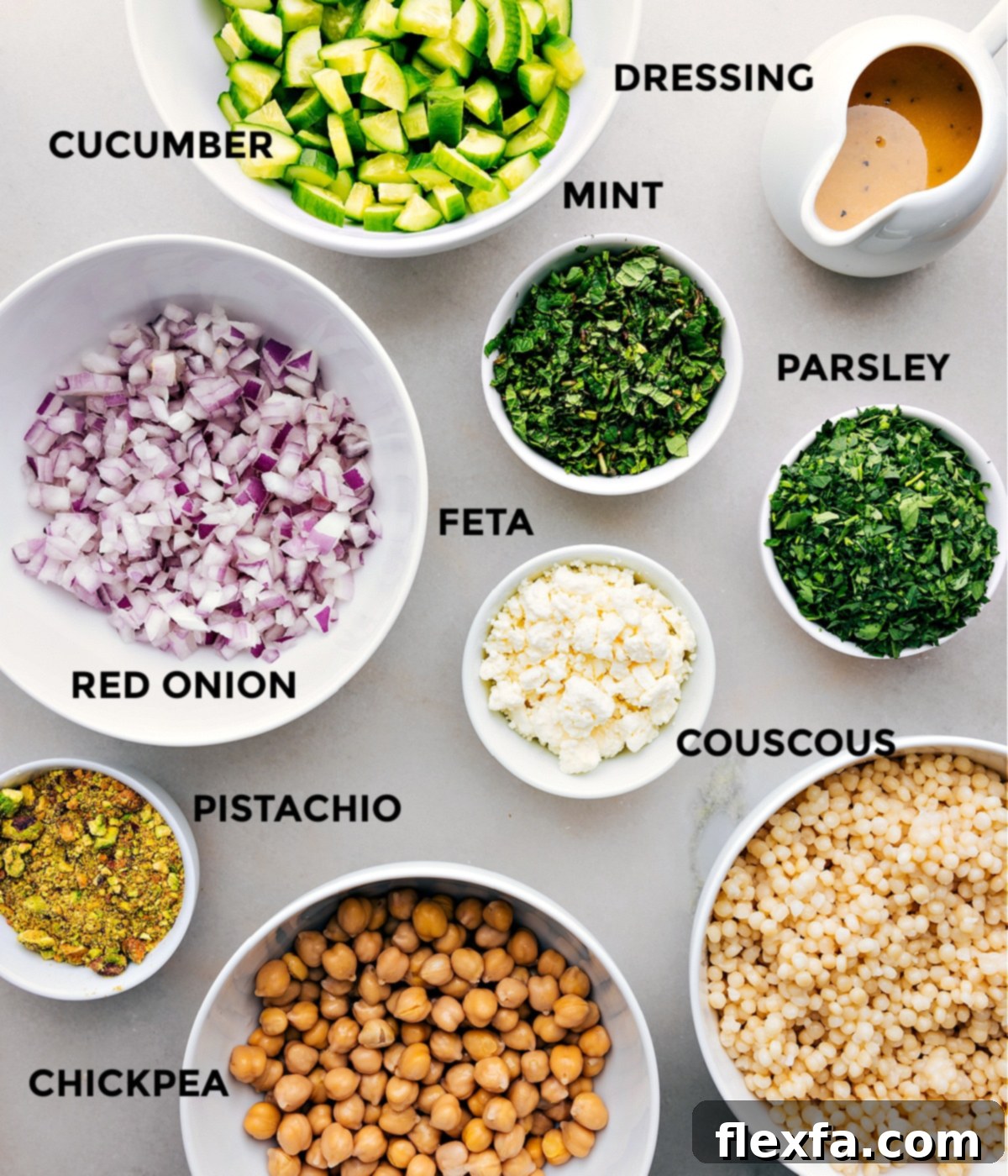 Ingredients In This Delicious Jennifer Aniston Salad All the vibrant ingredients for the Jennifer Aniston Salad prepped and arranged for assembly: fresh cucumbers, mint, parsley, creamy feta, Israeli couscous, crunchy pistachios, sharp red onion, and wholesome chickpeas, alongside the homemade dressing.