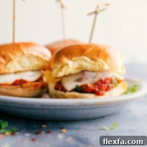 Close-up of a cooked meatball slider with melted cheese