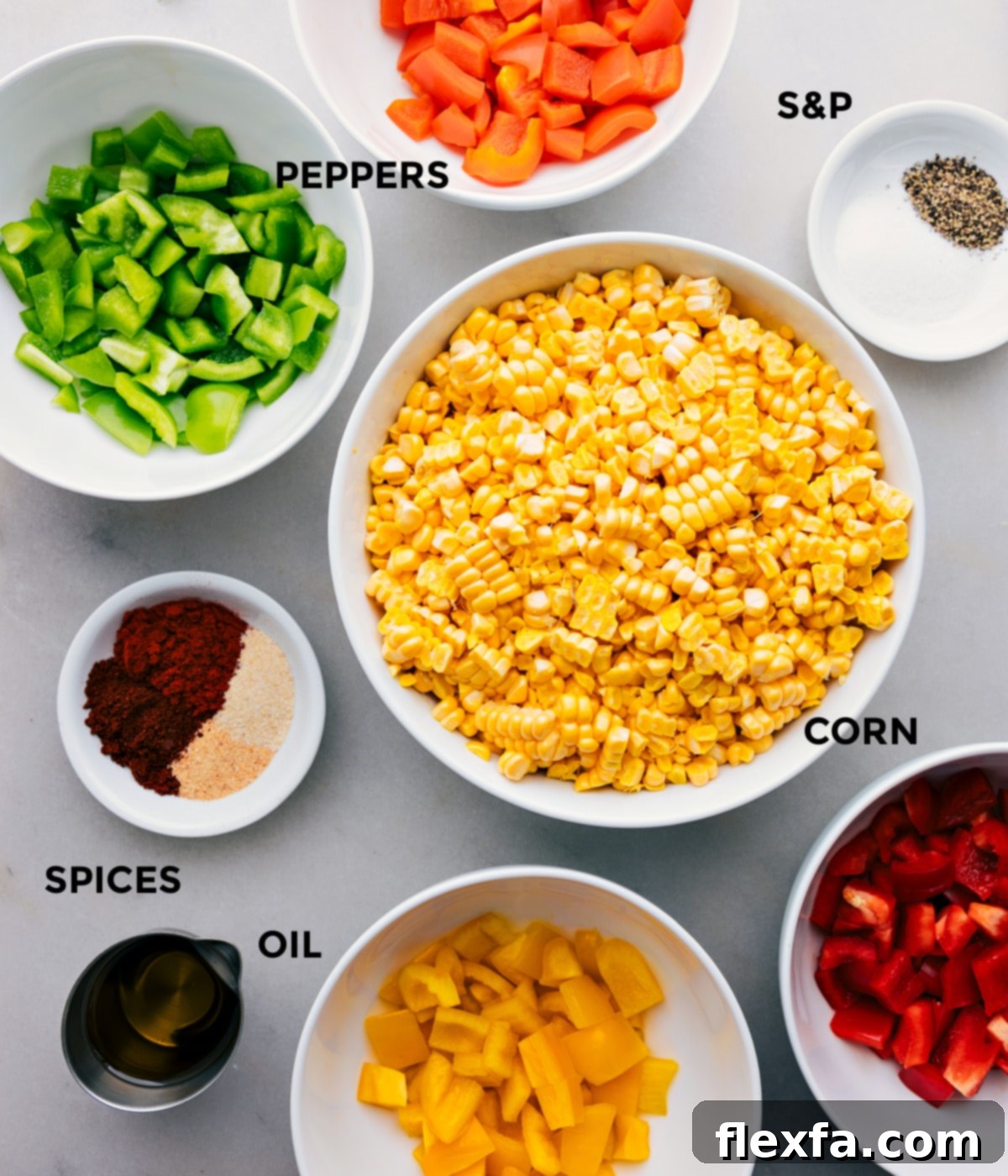 All the fresh ingredients for roasted corn, including corn kernels, diced bell peppers, olive oil, and various spices laid out on a clean surface before mixing.