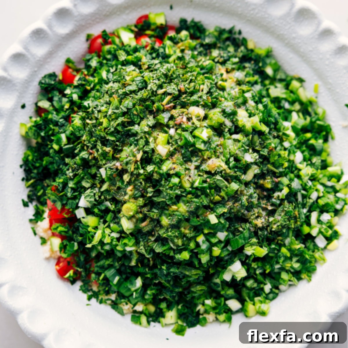 How To Make Tabouli All the freshly chopped ingredients, including cooled bulgur, cucumbers, tomatoes, mint, parsley, and green onions, are gathered in a large mixing bowl, ready to be gently tossed with the vibrant lemon herb dressing and enjoyed.