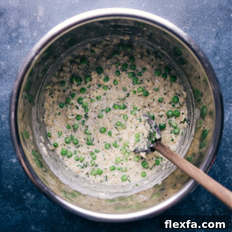 Perfectly cooked Instant Pot Risotto in the pot Overhead shot of the finished Instant Pot Risotto, still in the pressure cooker pot, garnished and ready to be served.