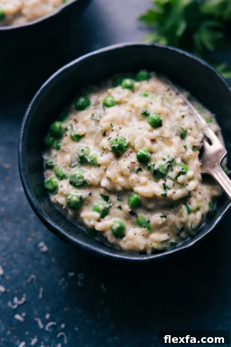 Delicious Instant Pot Risotto in a serving bowl A perfectly portioned bowl of Instant Pot Risotto, garnished with grated Parmesan and fresh green herbs, ready to be enjoyed.