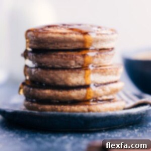 A serving of freshly cooked Applesauce Pancakes, light and fluffy, ready to be enjoyed.