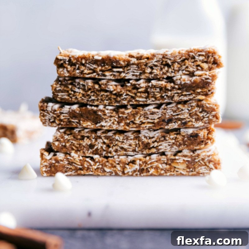 Soft and chewy homemade oatmeal granola bars stacked with a sweet white chocolate glaze
