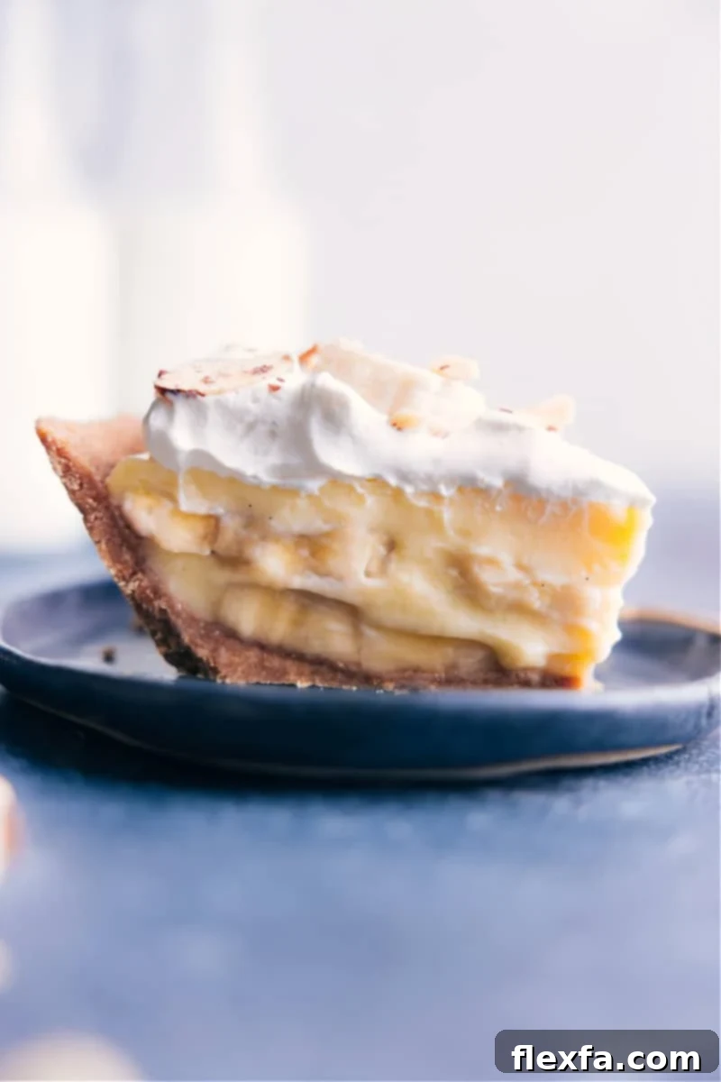 Image of a tempting slice of homemade Banana Cream Pie, showcasing its creamy layers and golden crust