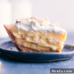 A beautiful, freshly prepared Banana Cream Pie slice, showcasing its rich layers