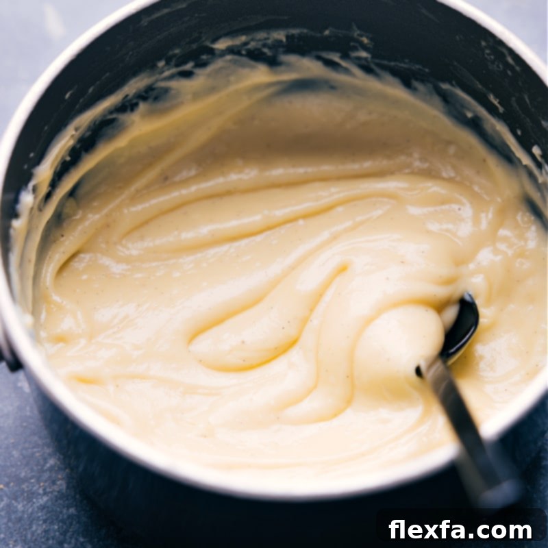 Making the custard for this banana cream pie. This image shows the perfect, thick pudding consistency required before adding to the pie crust.