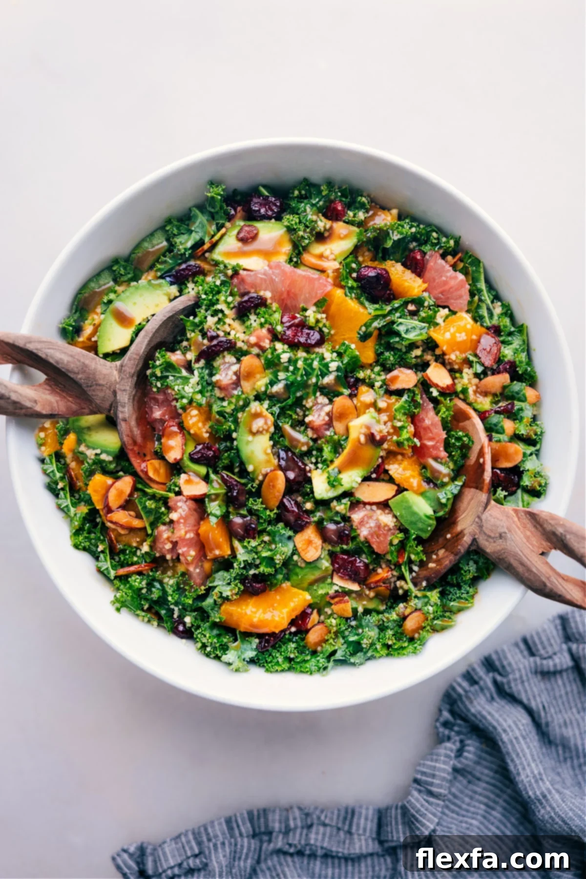 A beautifully presented Grapefruit Salad in a bowl, featuring vibrant citrus segments, green avocado, and almonds, ready to be served.