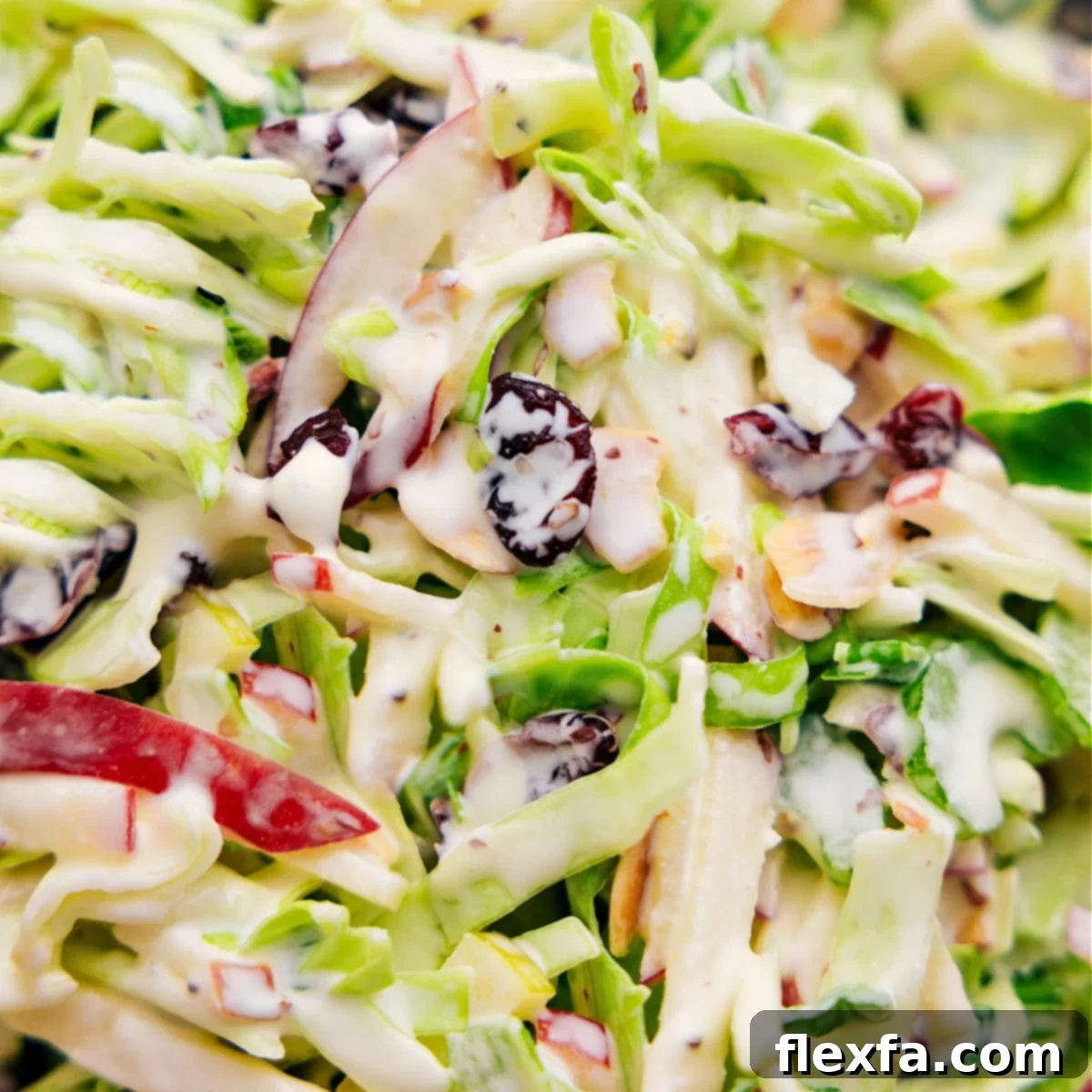 Apple coleslaw tossed together, dressed, and ready to be enjoyed in a rustic bowl, showcasing its appeal as a fresh side dish.