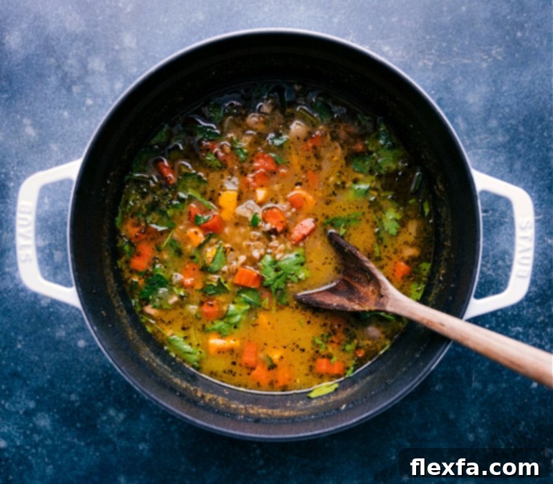 Delicious One-Pot Farro Soup Recipe The wholesome Farro Soup simmering gently in a large pot, perfectly cooked and ready to be served as a comforting one-pot meal.
