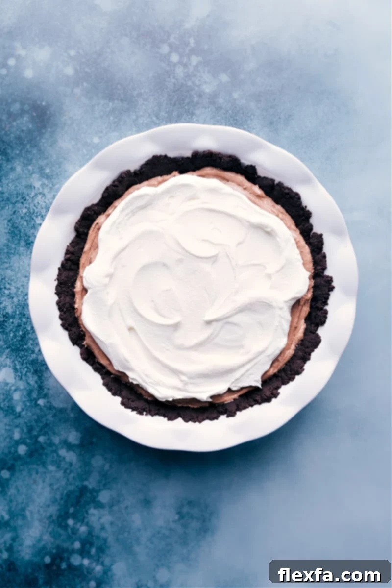 A pristine overhead shot of the completed Chocolate Pudding Pie, chilling in the refrigerator