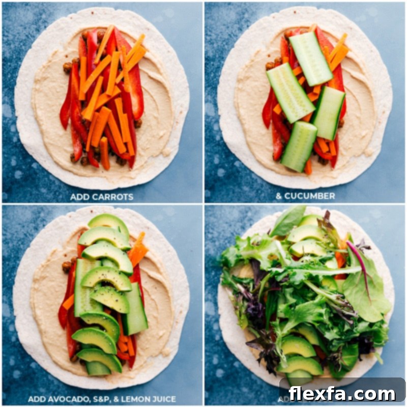 The best Hummus Wraps filled with flavorful crispy chickpeas, fresh layers of carrots, cucumbers, creamy avocados, and crisp lettuce on tortillas. Recipe via ChelseasMessyApron #healthy #dinner #lunch #quick #easy #simple #best #clean #cleaneating #wholefoods #chickpeas #vegetarian #vegan #hummus #wrap Close-up overhead view of assembled hummus wraps, showing layers of carrots, cucumbers, avocados, and lettuce, generously filled.