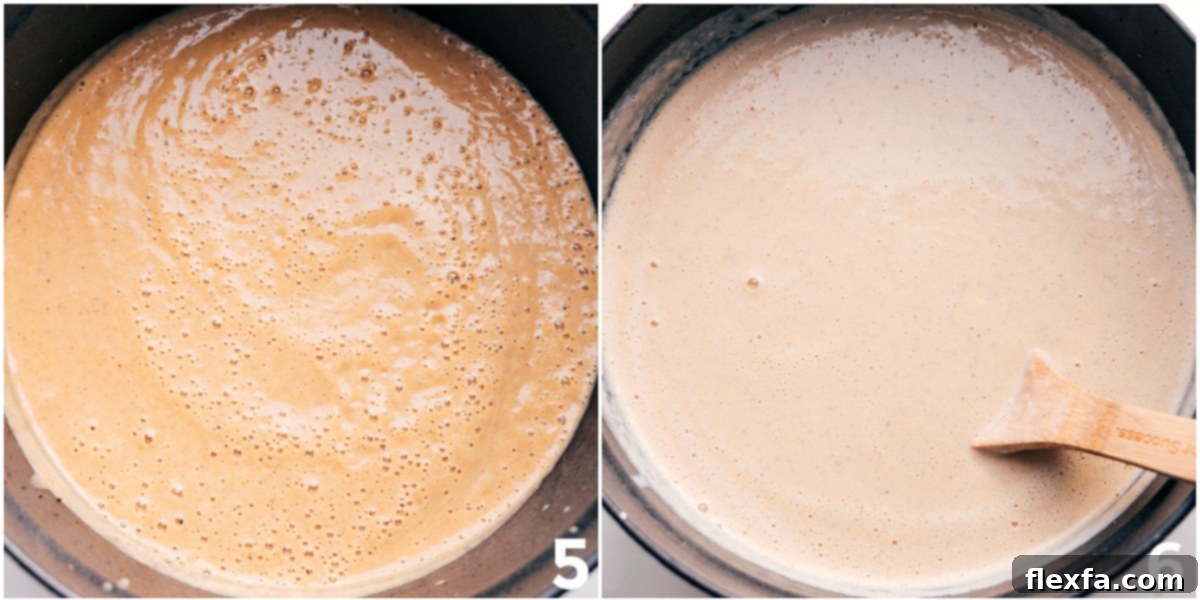 Close-up of the finished creamy cauliflower soup in a pot after blending all ingredients together, showing its rich, smooth texture.
