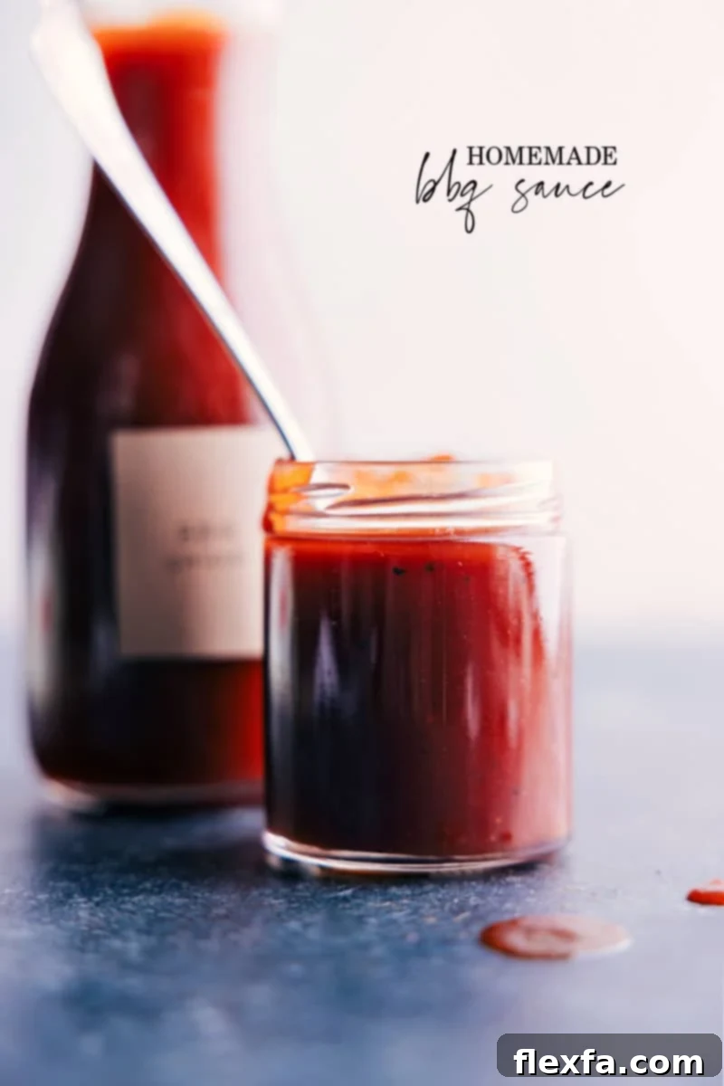 A jar of homemade BBQ sauce, showcasing its rich color and inviting texture, ready to be used.