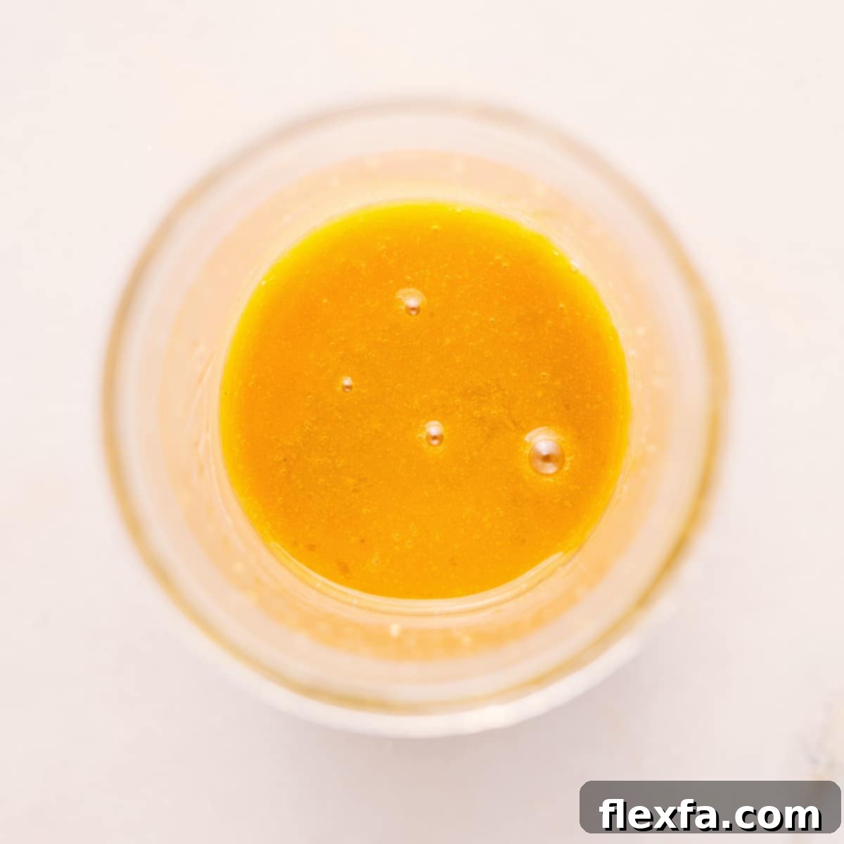 The fully mixed White Balsamic Vinaigrette, showcasing its smooth, emulsified texture, ready to be served and enjoyed on a variety of dishes.