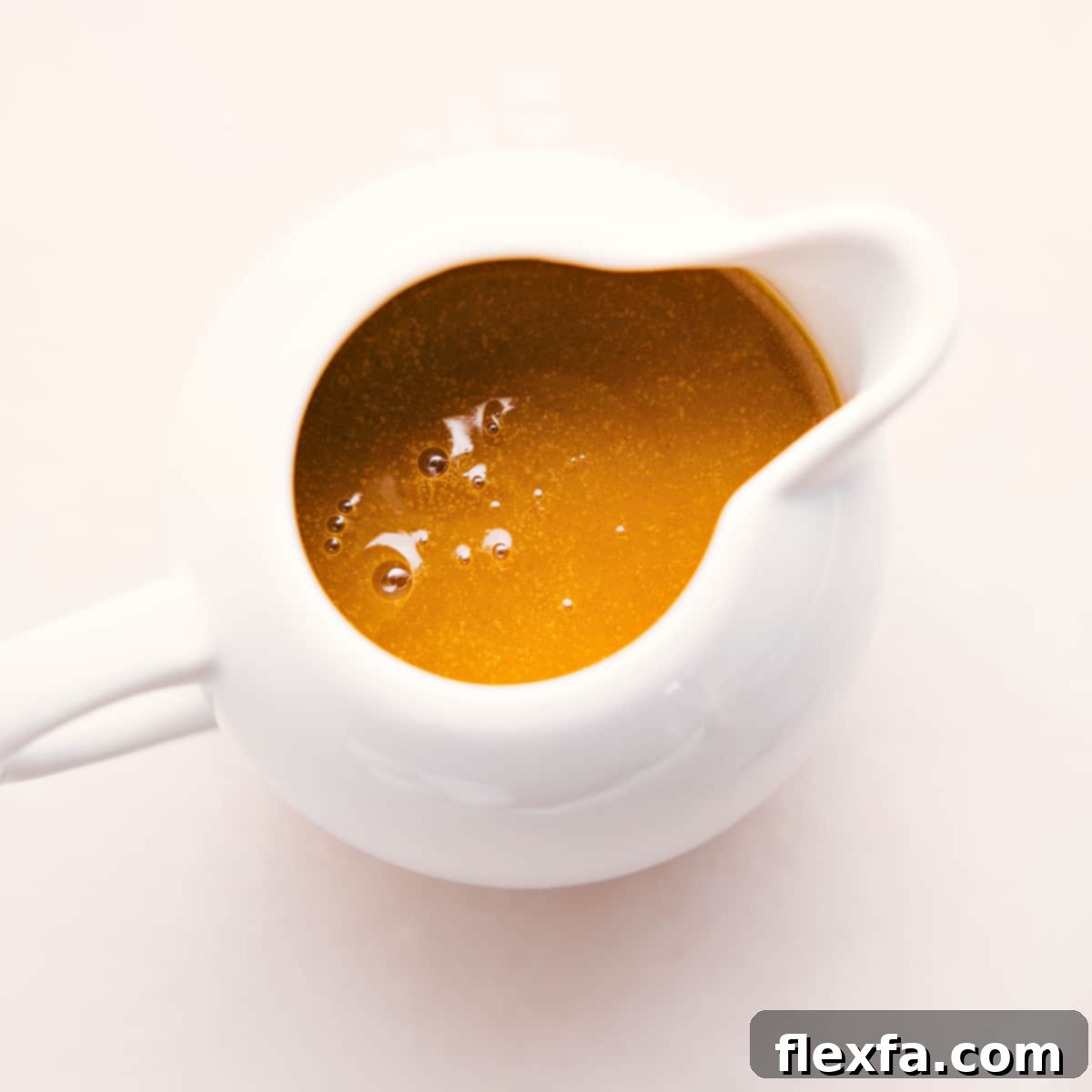 Beautifully prepared Homemade White Balsamic Vinaigrette in a elegant glass dressing jar, perfectly emulsified and ready to serve, promising to enhance any meal.