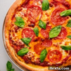 Delicious homemade pizza dough ready to be topped and baked.