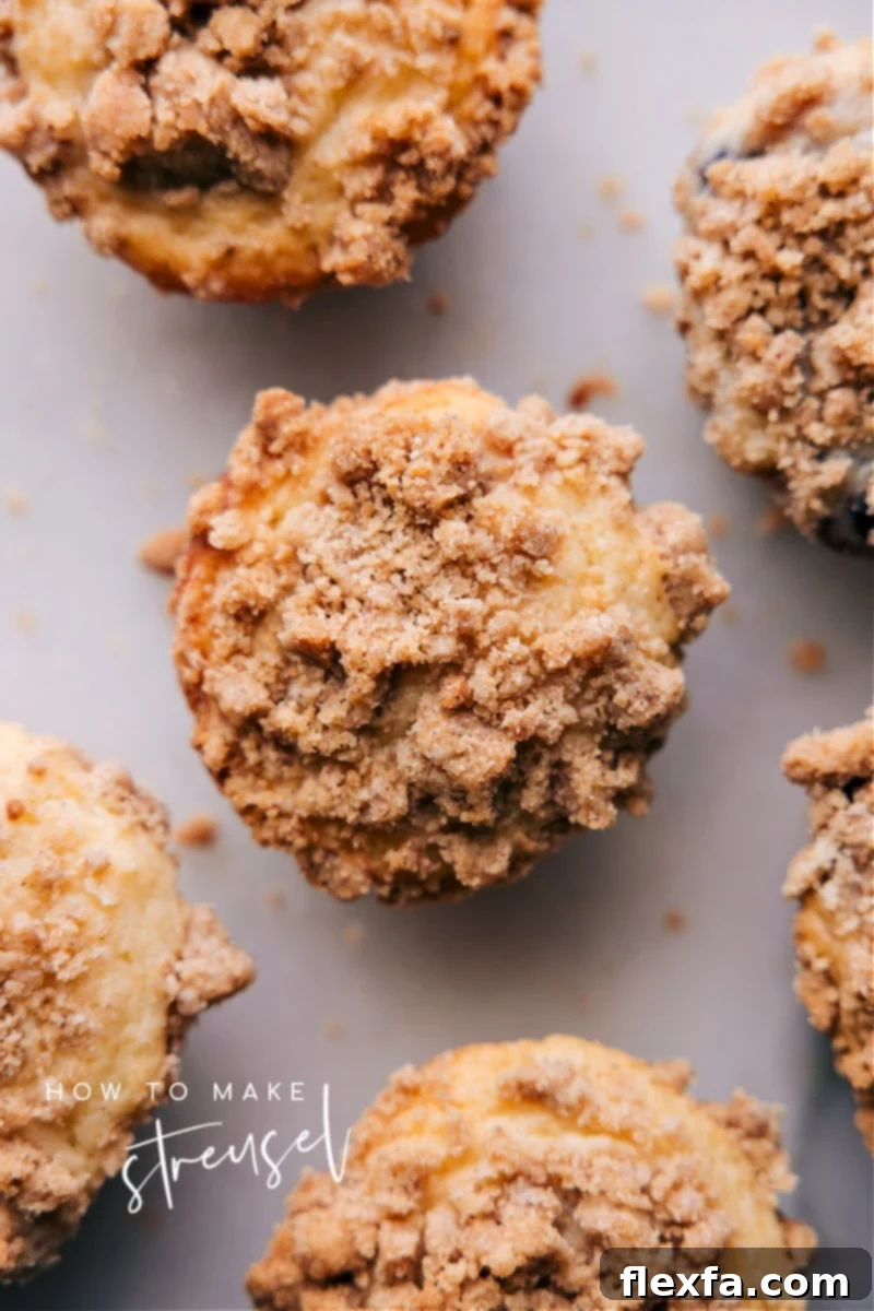 Overhead image of muffins with golden-brown streusel topping, ready to be enjoyed.