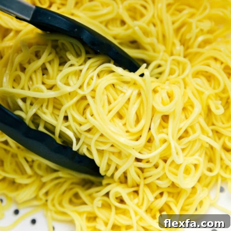 Cooked pasta ready to be added to the chicken chow mein recipe, perfectly cooked and ready to absorb flavors.