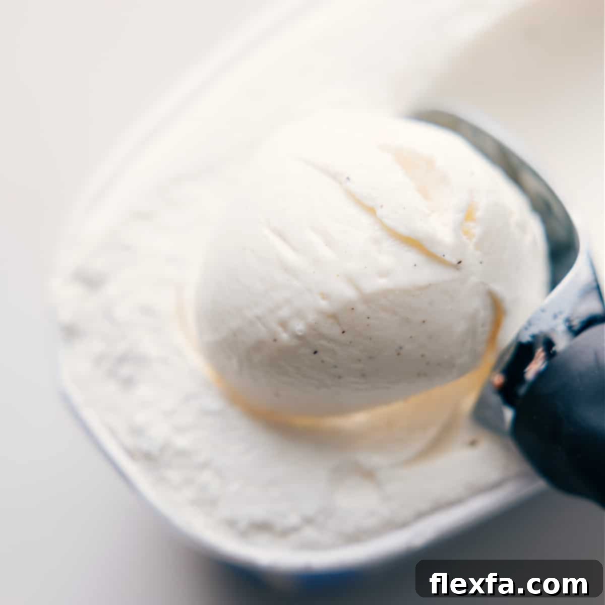 Scooping vanilla bean ice cream into the blender for a Shamrock Shake.