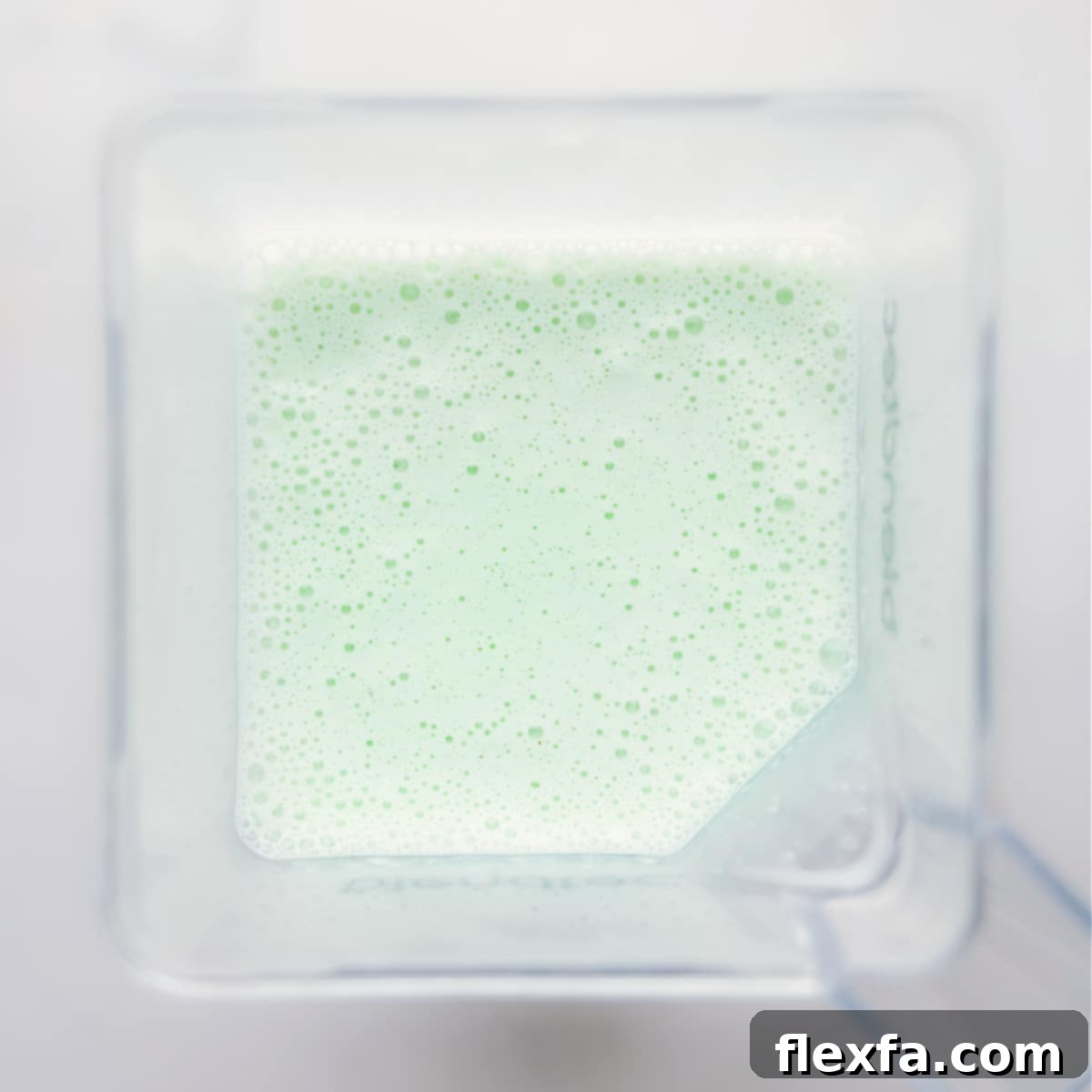 Shamrock Shake freshly blended and poured into a glass, ready to be served.