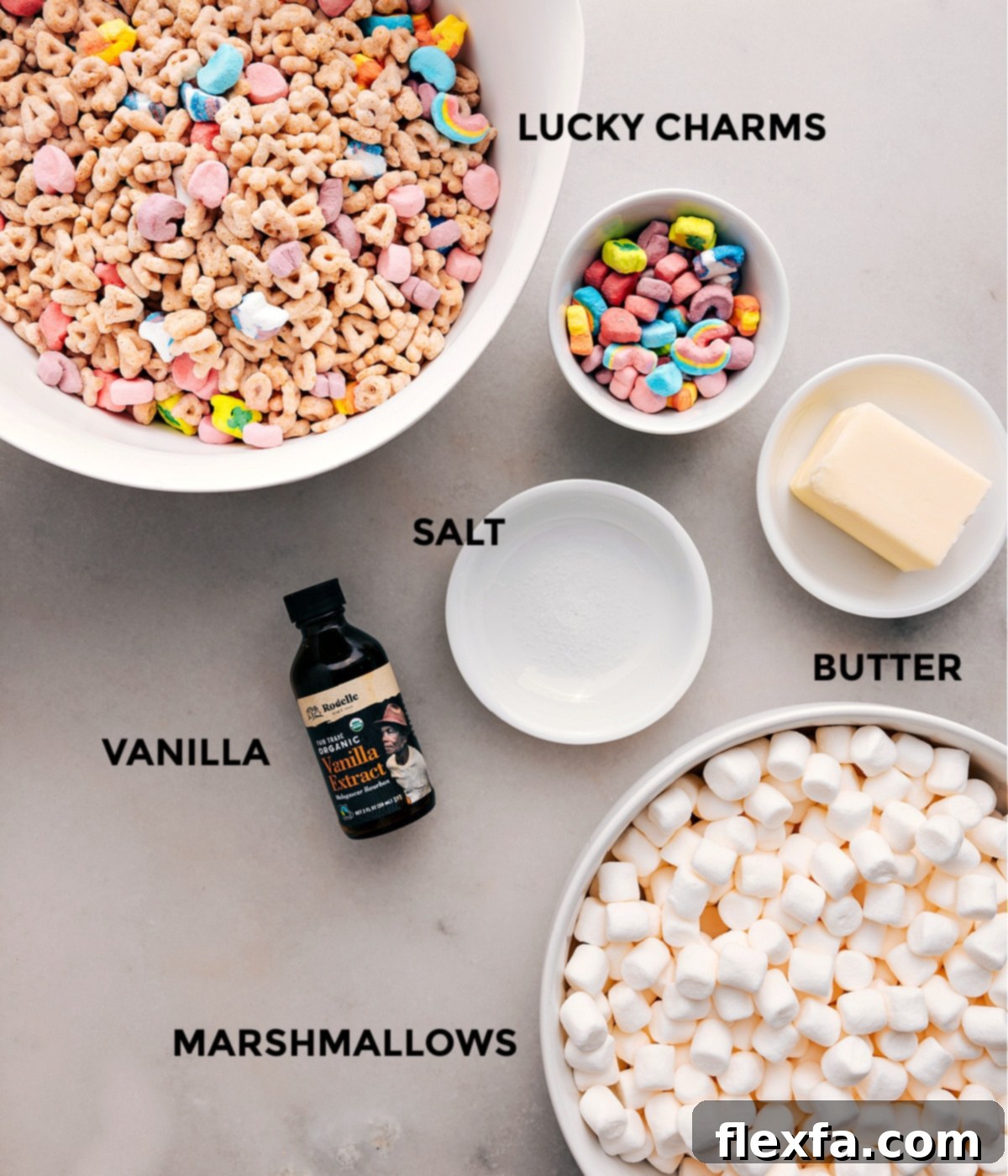 All the essential ingredients for Lucky Charms Bars neatly prepped: cereal, unsalted butter, sea salt, vanilla extract, and miniature marshmallows.