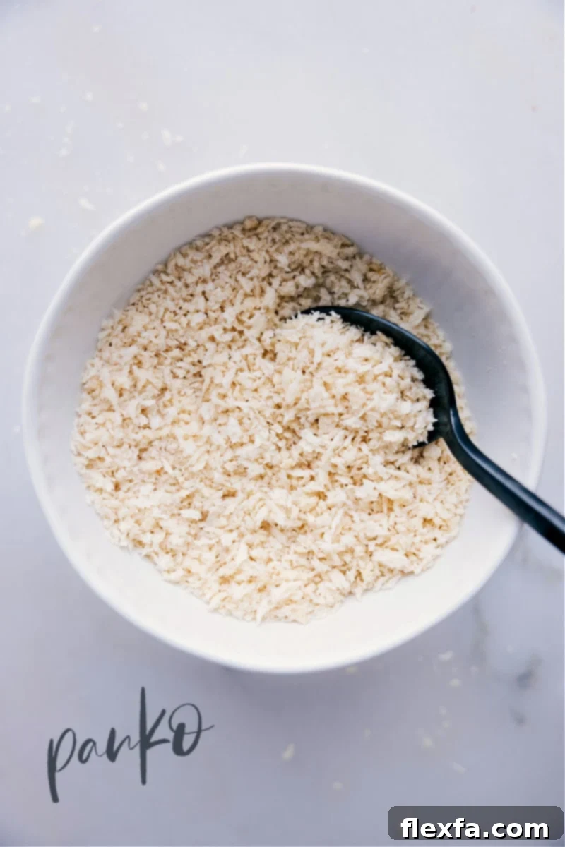 Image of golden Panko breadcrumbs in a rustic bowl, ready for use in cooking
