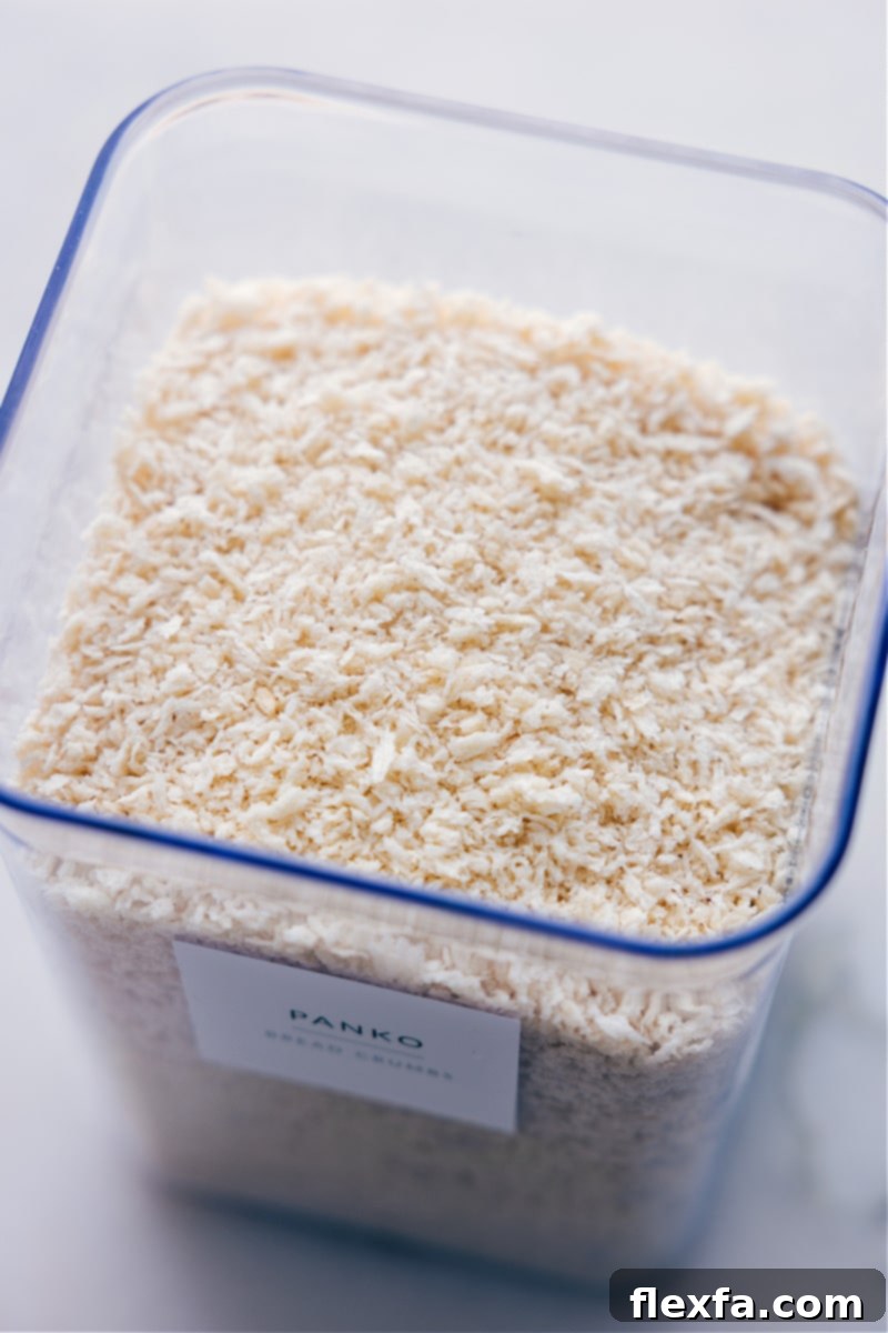 Overhead shot of an open container filled with Panko breadcrumbs, highlighting their texture and quantity