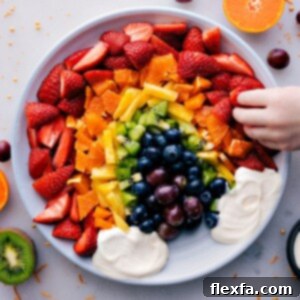 A colorful Fruit Rainbow Tray with creamy dip.