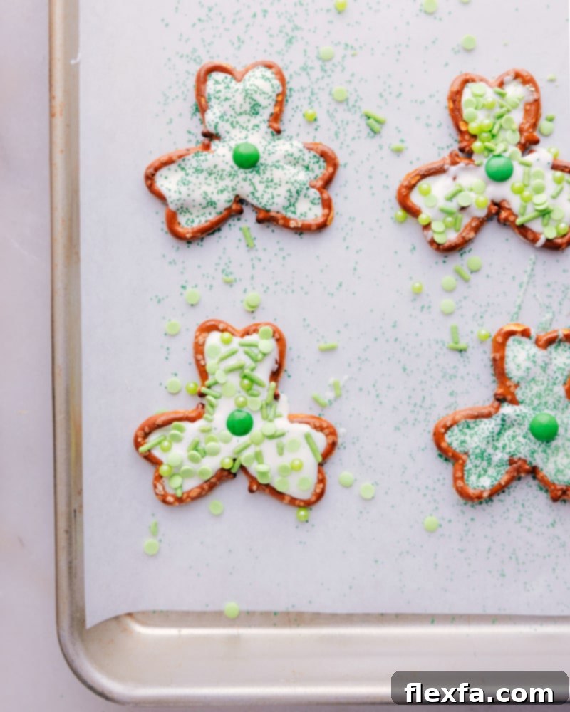 An overhead shot of several finished Pretzel Shamrocks neatly arranged on a tray, ready for serving.